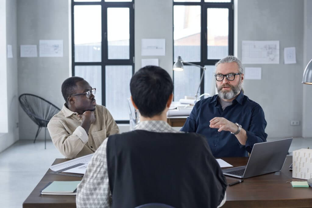 Business people sitting at director's office