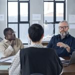 Business people sitting at director's office