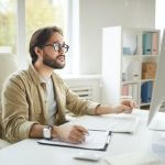 Software engineer analyzing computer error