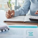 Woman in accounting, payroll, tax, credit and bank payment for startup company in an office. Busine